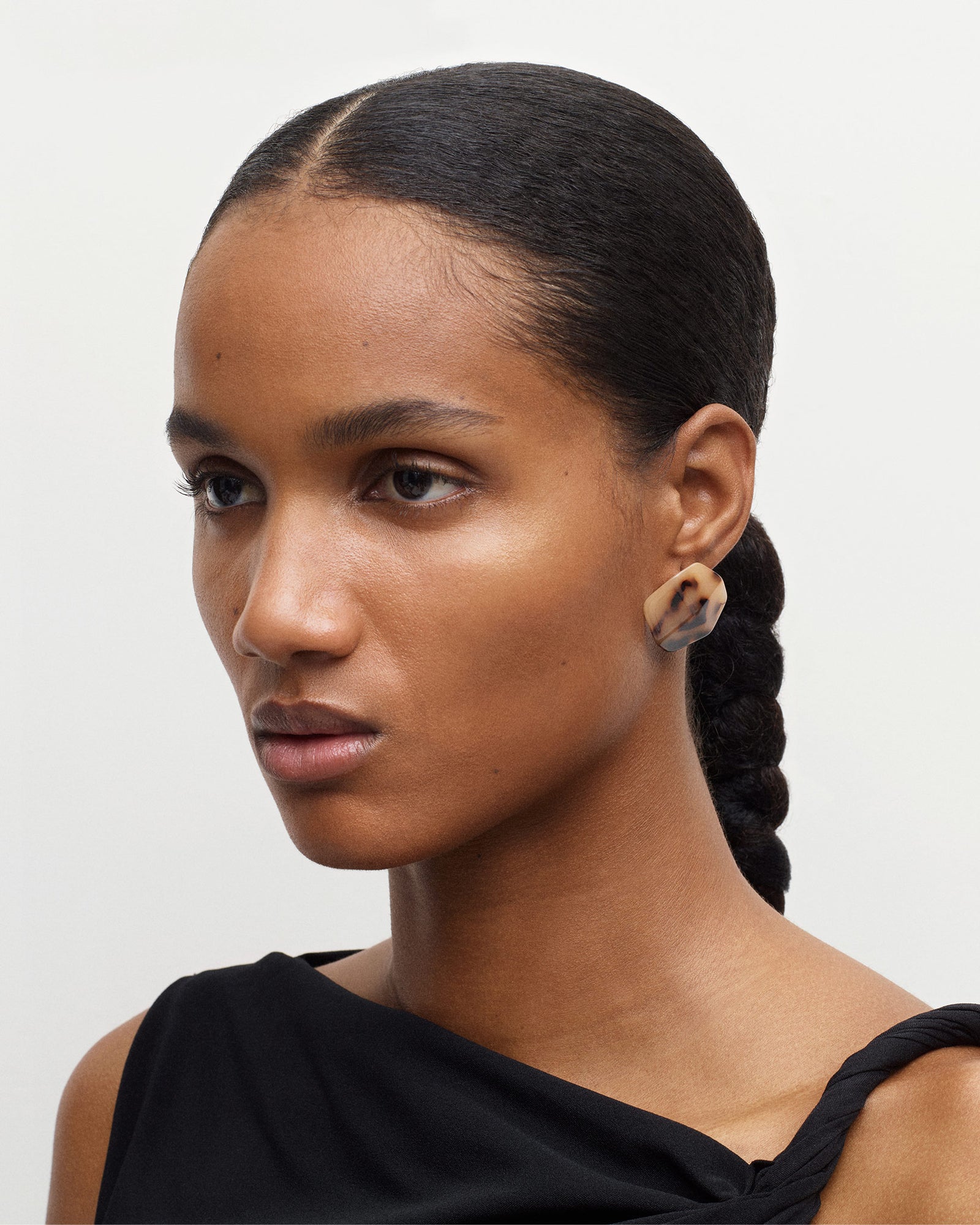 MACHETE model wearing blonde tortoise stud earrings