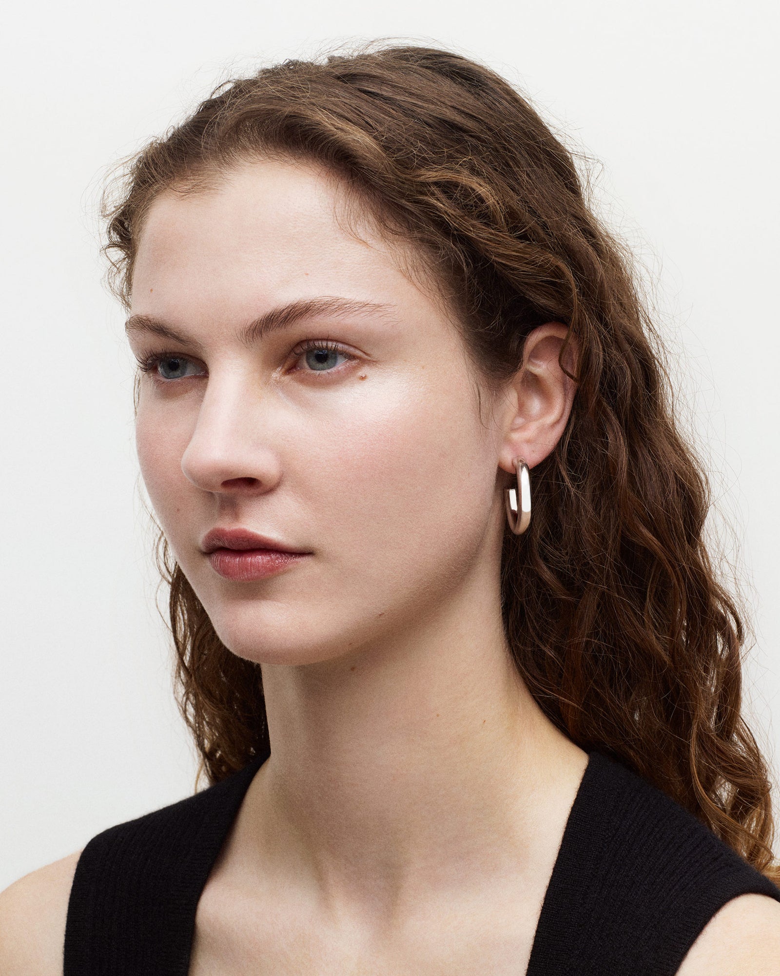 MACHETE Model wearing silver 1" perfect hoop earrings