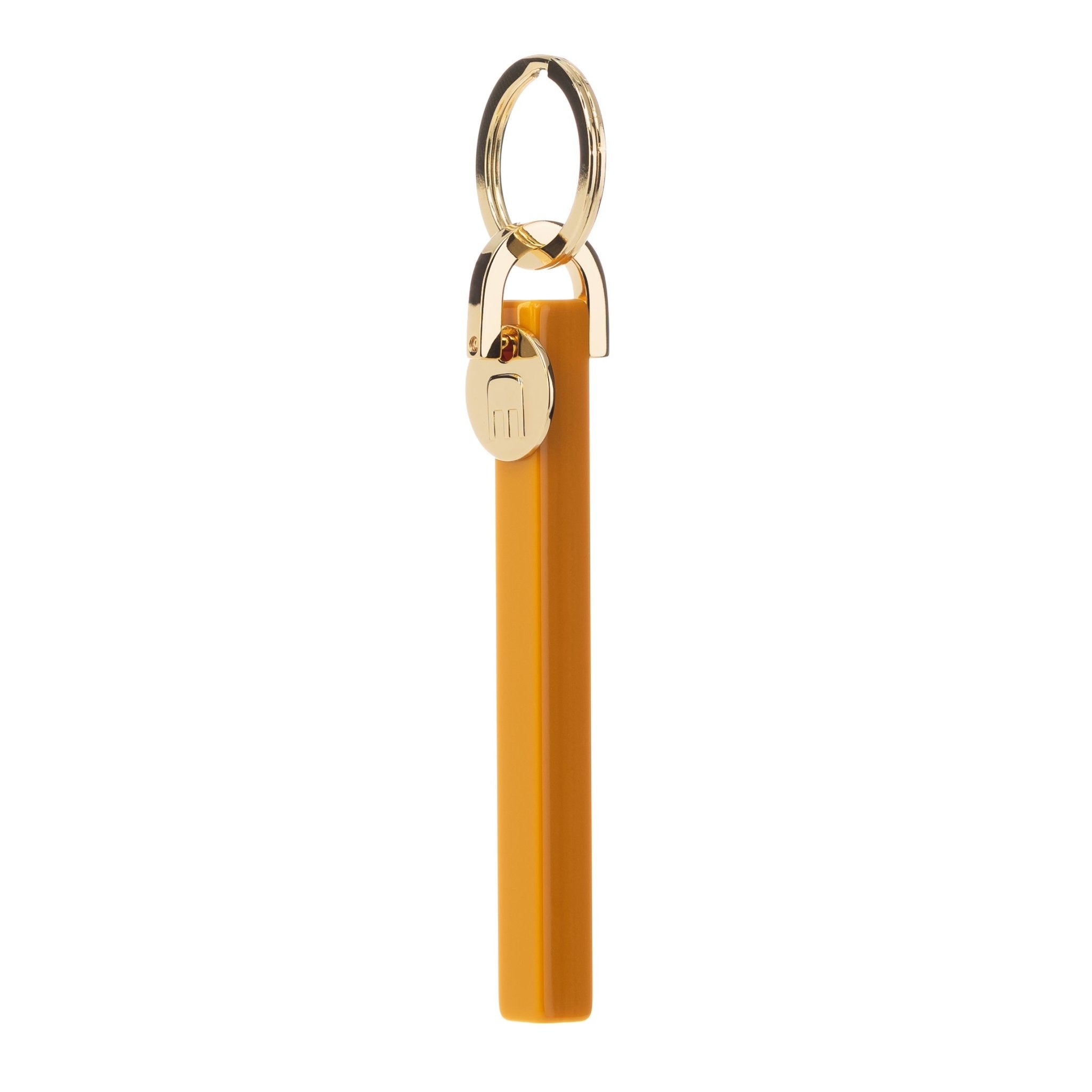 Machete keychain with ochre acetate bar. MACHETE